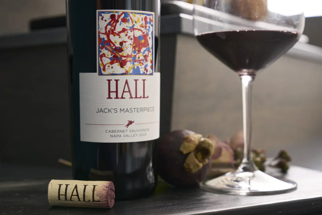 A bottle of Jack's Masterpiece Cabernet Sauvignon and a glass of wine next to it