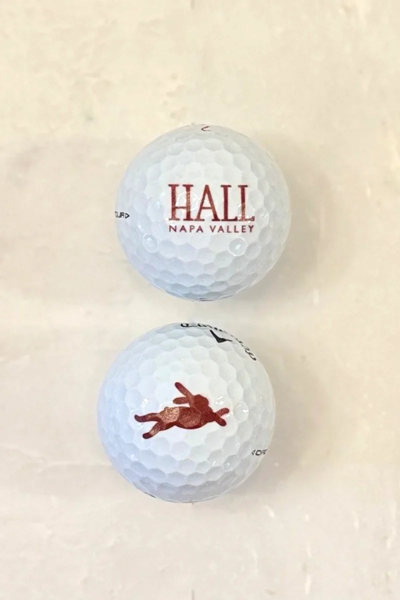 Callaway Chrome Tour golf balls featuring HALL Napa Valley and Bunny Foo Foo logos on a white background