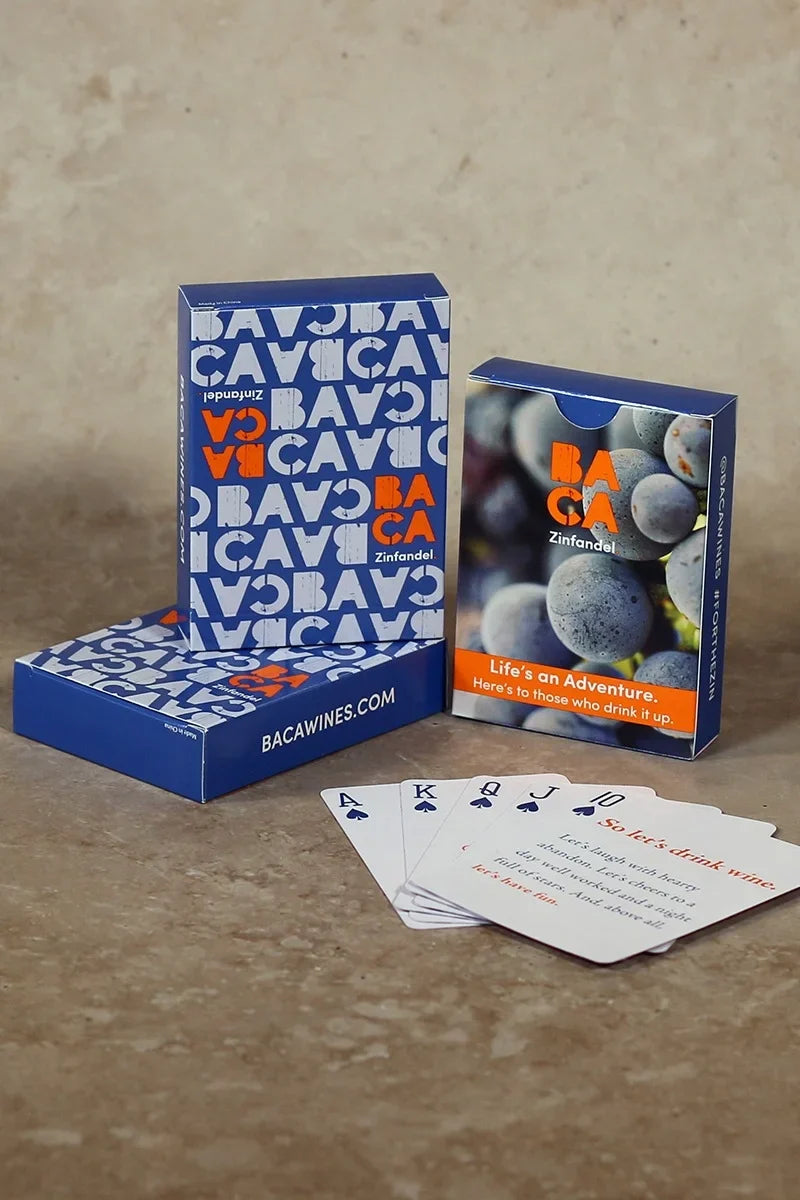Image of 3 decks of BACA playing cards with a Royal flush lines up in front of the packs.